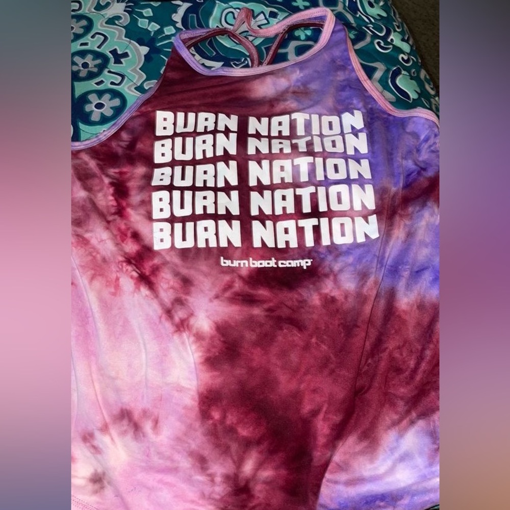 two work out shirts along with a pair of biker shorts and one workout set